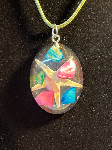 Starfish w/ pink, blue & green rocks inlaid oval necklace